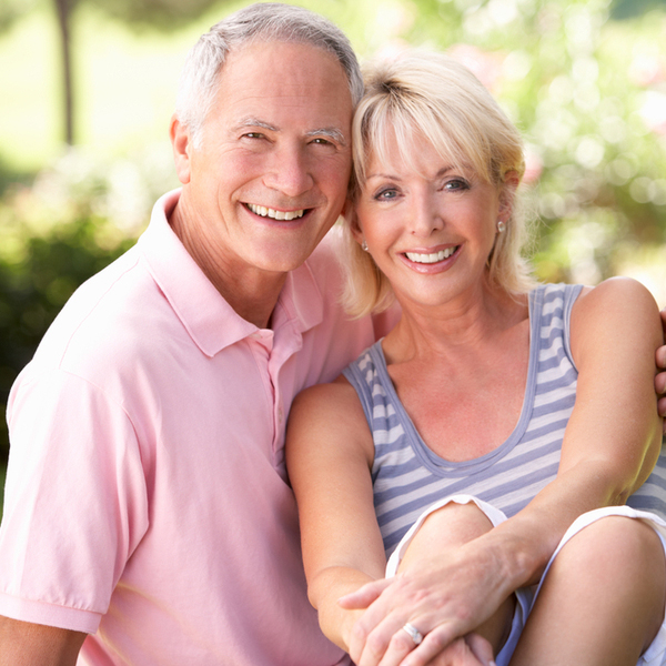 Elderly Couple Sitting Outdoors